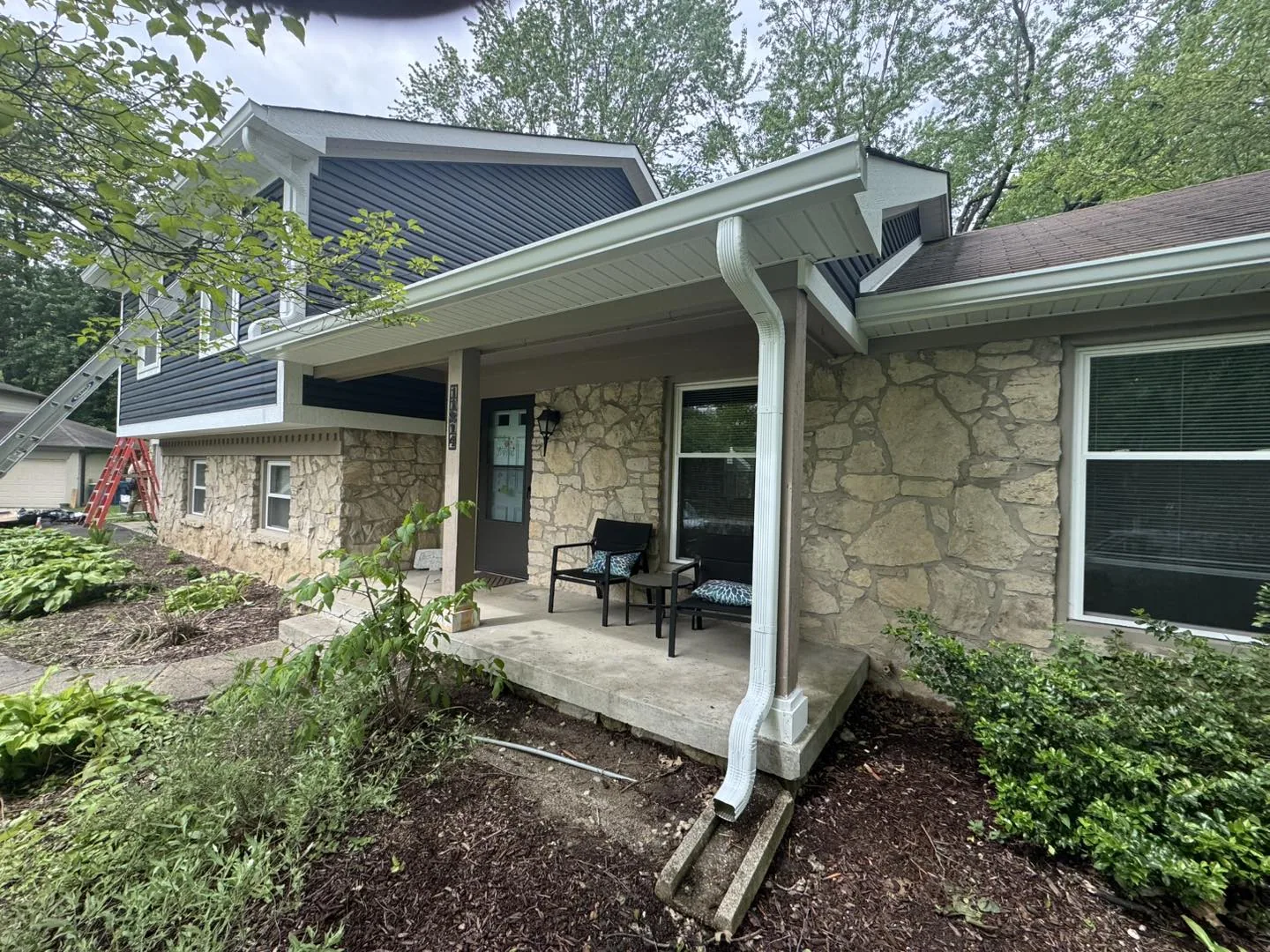 Porch Downspout by Bryant's Seamless Guttering