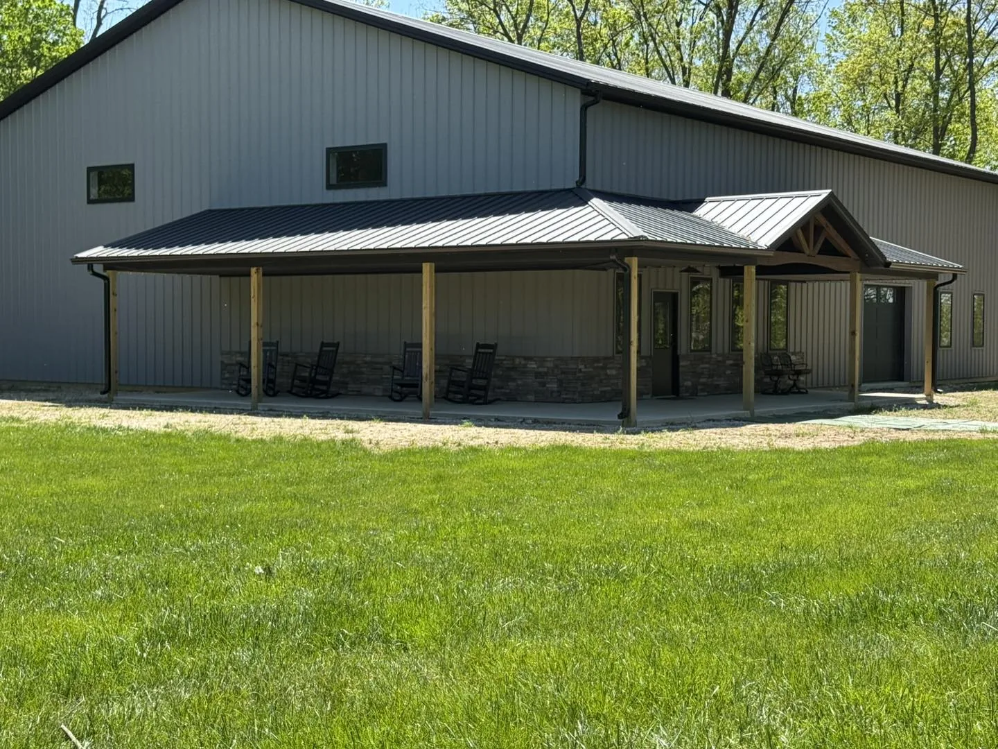 Covered porch with Bryant gutter work on a metal roof